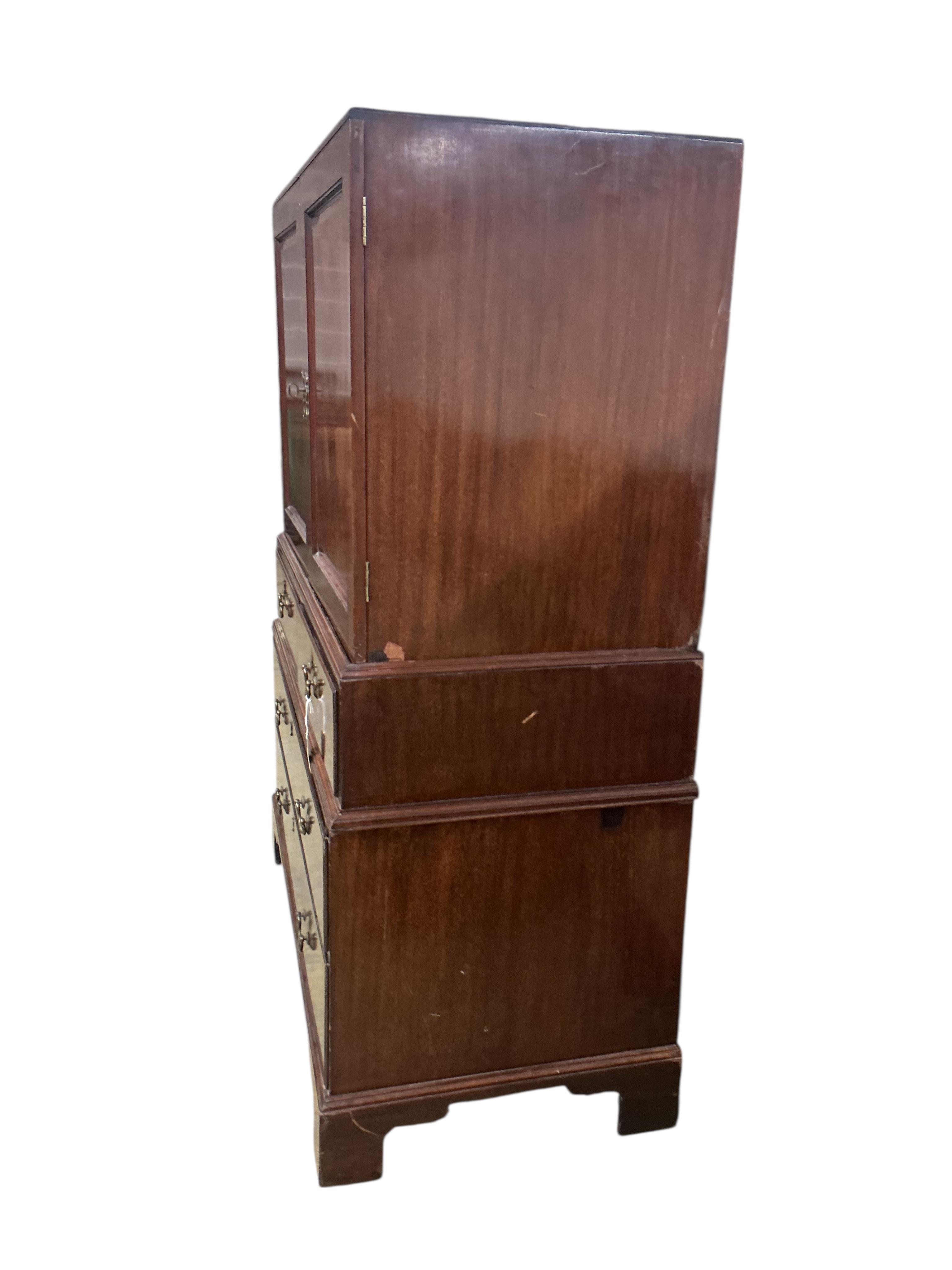 A George II mahogany three part linen press, width 122cm, depth 62cm, height 166cm